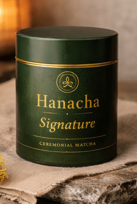 Hanacha Signature tin resting on linen and stone