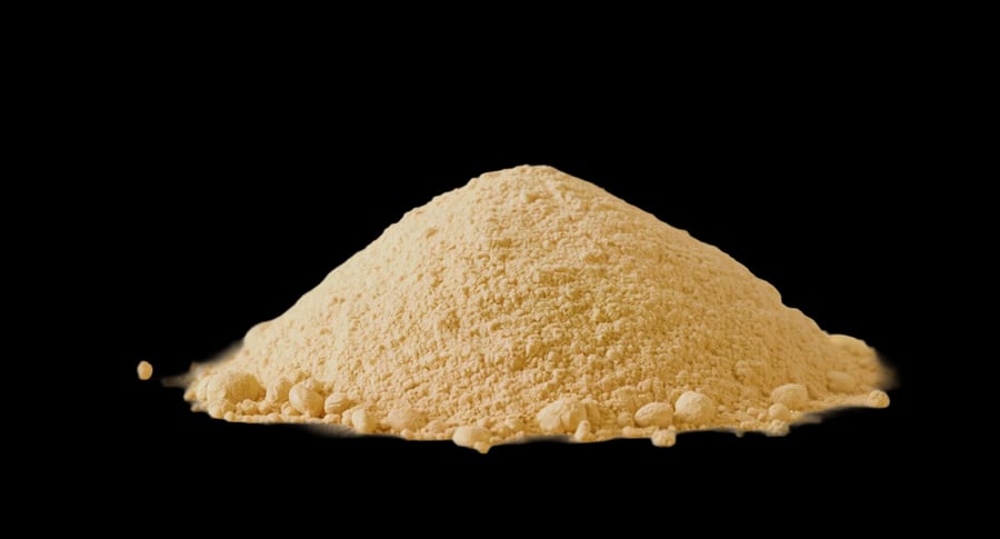 A mound of fine golden-beige roasted soybean powder